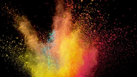 Super slowmotion shot of color powder explosions isolated on black background Stock Footage