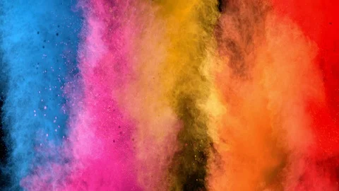 Super slowmotion shot of color powder explosions isolated on black background. Stock Footage