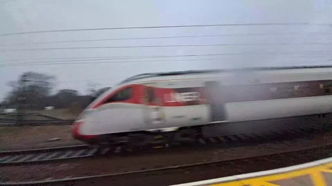Super speed train watched from the platform. Stock Footage 234420031