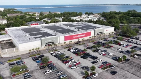 Super Target store rooftop covered in solar panels, packed parking lot, palm Stock-Footage 339073975