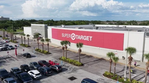 Super Target store showcases bold red logo signage beneath vast solar panel Stock Footage 339994119