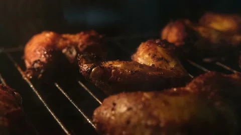 Super tasty sharp chicken legs are fried in the oven close-up Stock Footage 201162979
