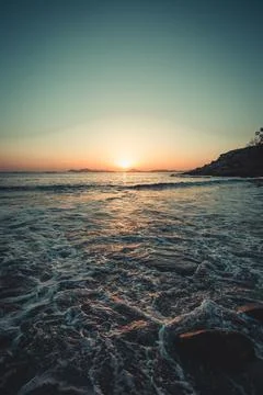 Super textured tides on the beach during a colorful sunset in a spanish beach Stock Photos