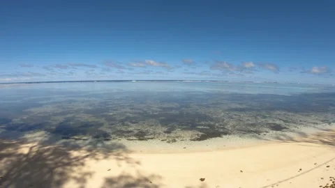 Super wide angle hand hold still view of calm peaceful turquoise blue lagoon loo Stock Footage 235323063