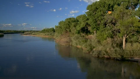 Super wide, beautiful right to left pan of Rio Grande river over blue water. Stock Footage 126995598