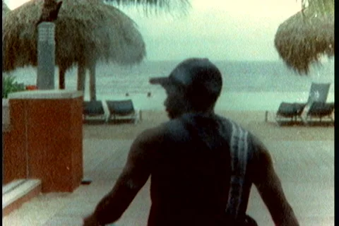 Super8 black man on the beach Stock Footage 40736037