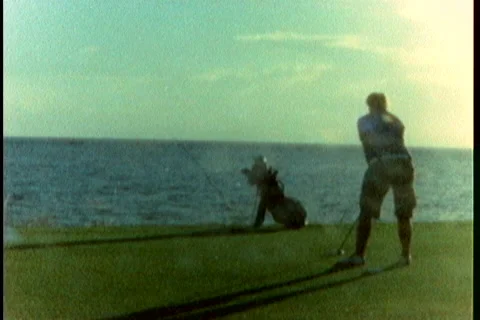 Super8 golf swing at seaside Stock Footage 40735495