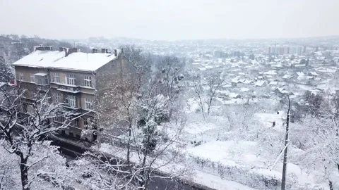 Superb view from a height of the snow-covered old town. Cold weather, long Video stock 230551877