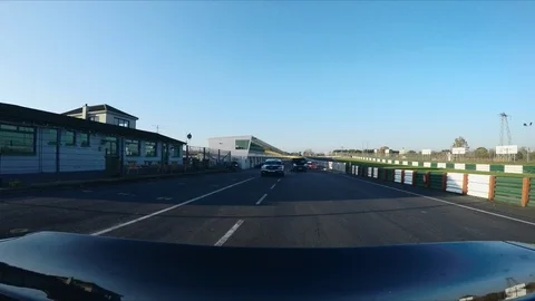 SUPERCAR on a RACE circuit - CAMERA ATTACHED TO THE BACK Video stock 127414539