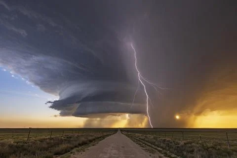 Supercell and Cloud to Ground Lightning at Sunset Stock Photos