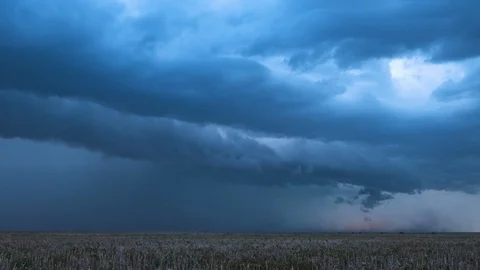 Supercell lightning storm moving over the landscape Stock Footage