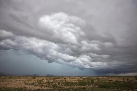 A supercell storm, cloud formations just above the horizon, white clouds an.. Stock Photos