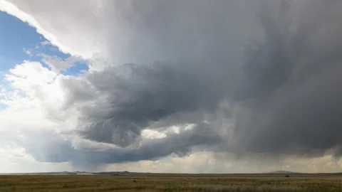 Supercell Thunderstorm Spins Over Open Field Stock Footage 272756959