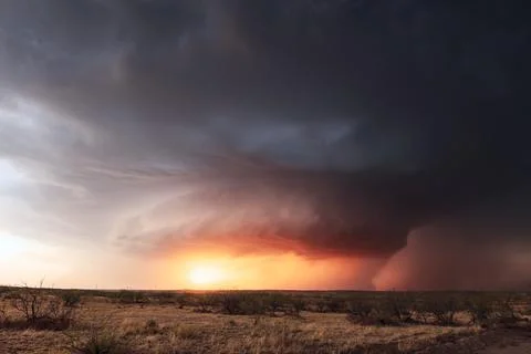 Supercell thunderstorm at sunset Stock Photos