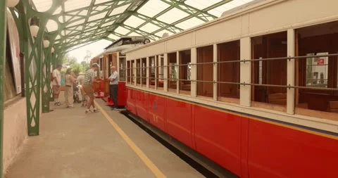 Superga station platform with the iconic red tram waiting passengers, Italy Stock Footage 340541570