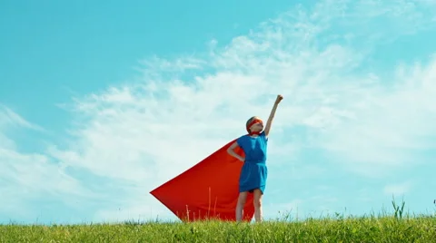 Superhero 7-8 years old protects the world against the blue sky Stock Footage 64032742