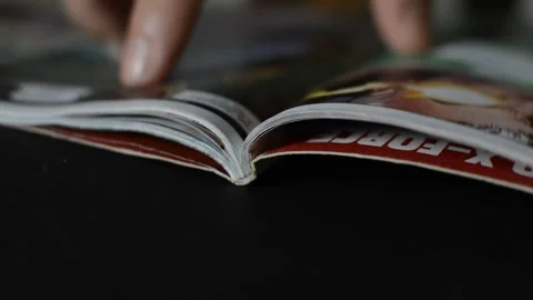 Superhero comic book. caucasian young man read a superhero comic book. Stock Footage 245479942