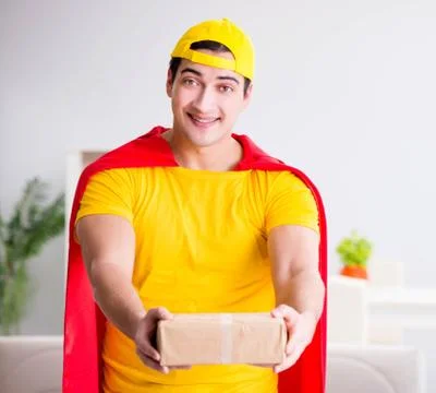 Superhero delivery guy with box Stock Photos