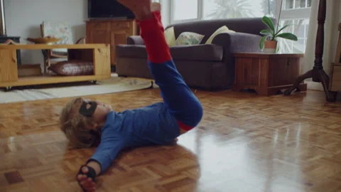 Superhero kid falling to the floor Stock Footage 279181911