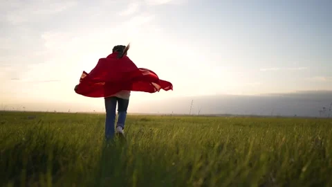 Superhero runs at sunset in red Stock Video Pond5