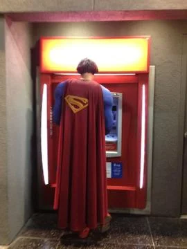 Superman at the ATM Stock Photos
