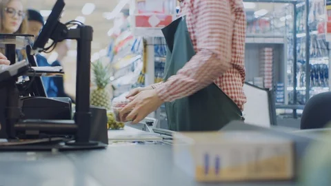 At the Supermarket: Checkout Counter Hands of the Cashier Scans Groceries, Food Stock Footage 94327305