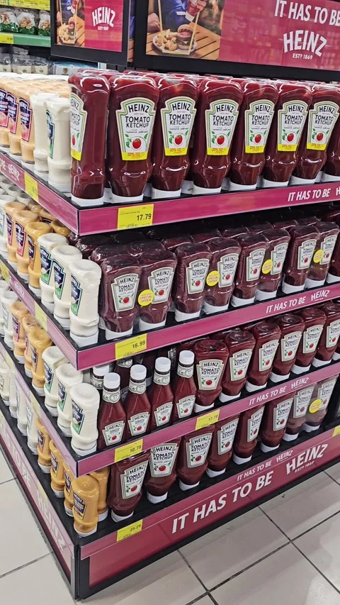 Supermarket endcap display filled with rows of Heinz ketchup, mayonnaise 스톡 동영상 341459804