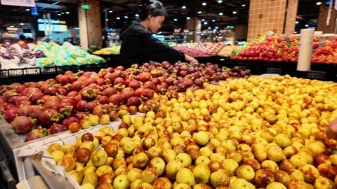 Supermarket Fruit Section Red Plums and Jujubes Video stock 345974698