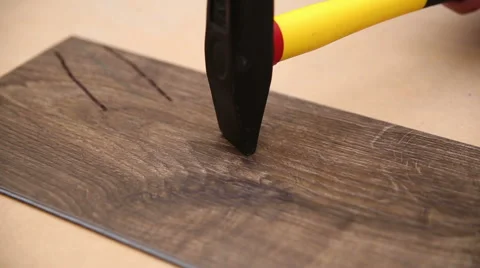 SuperMarket, man knocks with a hammer on the board Stock Footage 66439192