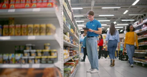 Supermarket Manager Working on Tablet Stock Footage 295821149