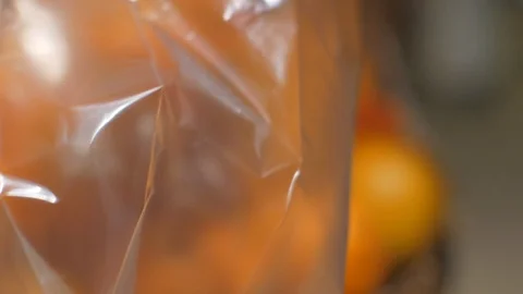 Supermarket oranges in a plastic bag Stockbeeldmateriaal 86269792
