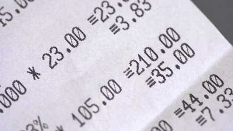 Supermarket paper receipt from the cash register close up Stock Footage