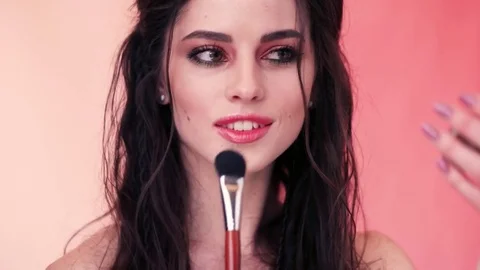 Supermodel makes herself a make-up Stock Footage
