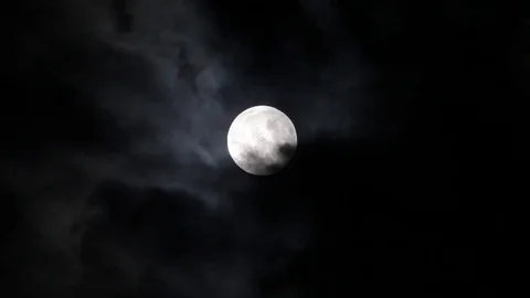 Supermoon Large Bright Moon moves across the night sky with cloud. Stock Footage 84755596