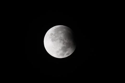 Supermoon with a partial lunar eclipse sets over the old city of Jerusalem - 18  Stock Photos
