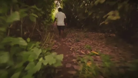 Supernatural Entity Chasing an Unsuspecting Man: A fast-paced first-person track Stock Footage 346993979