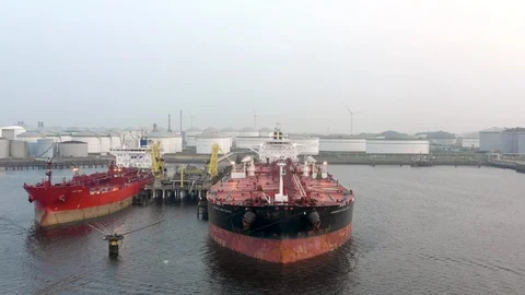 Supertanker Ship Docked in Rotterdam Offloading Goods and Cargo Stock Footage 94718846