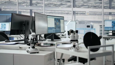 Supervising integrated circuits, monitors and microchip production office Stock Footage 335880878