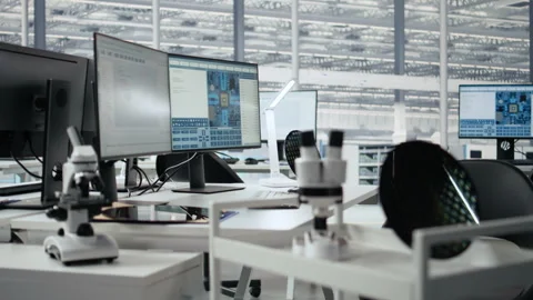 Supervising integrated circuits, monitors and microchip production office Stock Footage 335882778
