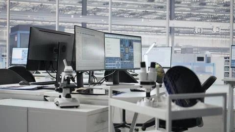 Supervising integrated circuits, monitors and microchip production office Stock Photos
