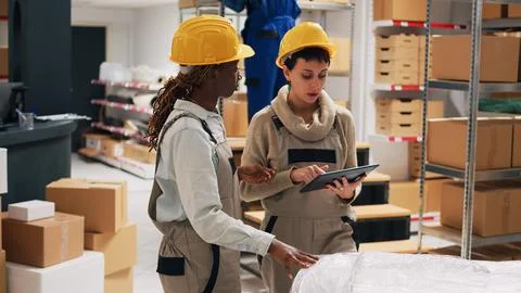 Supervisor and employee using digital tablet Fotos Stock
