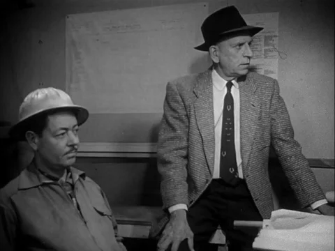 Supervisor and owner discuss the mental condition of their worker, Tomy - 1958 Stock Footage 97229216