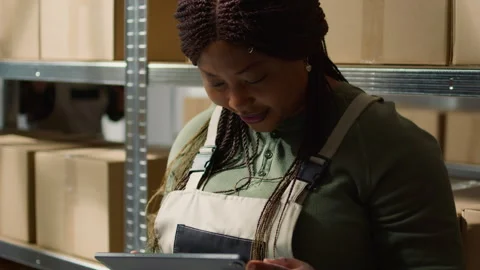 Supervisor checks warehouse parcels 스톡 동영상 250569637