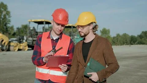 Supervisor communicate with man, controlling work process Stock Photos