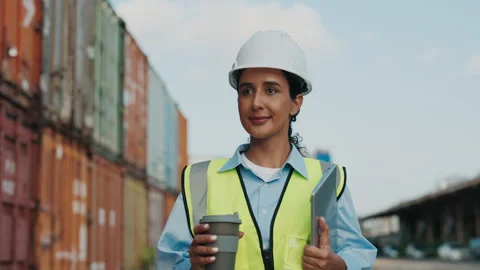 Supervisor In Container Terminal Walking While Holding Coffee And Computer Stock Footage 311942091