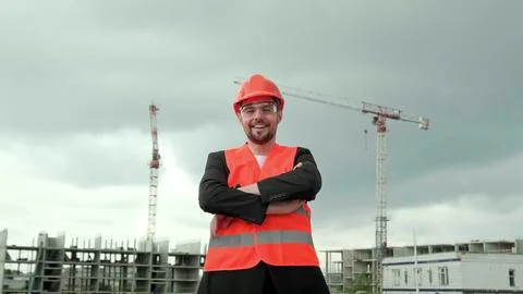 Supervisor controlling work process on construction site, working Stock Photos