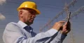 Supervisor Engineer Using Tablet Checking Power Transfer Voltage Distribution 4k or 4k+ Resolution