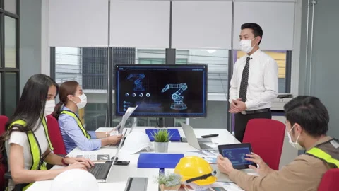 Supervisor of the engineering team is presenting operation of machines Stock Footage 140212786