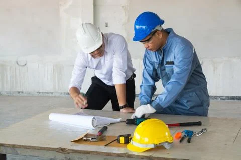 Supervisor foreman or Architect discuss with Technical Engineer or Civil Work Stock Photos