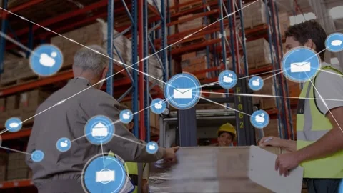 Supervisor inspecting wrapped pallet and guiding hand-off in warehouse while Stock Footage 329836576